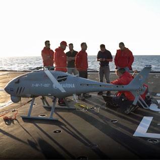 Engineers working with AWHERO on-board a naval platform
